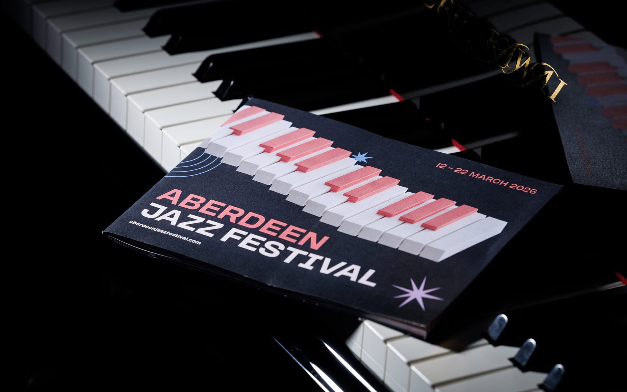 Aberdeen Jazz Festival 2026 programme resting on piano keys