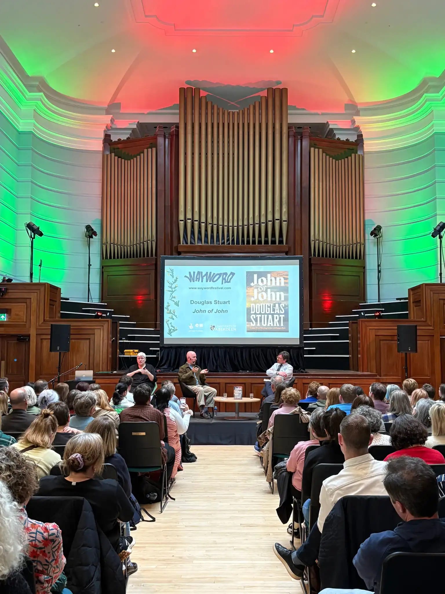 Photo of three people on stage at WayWORD
