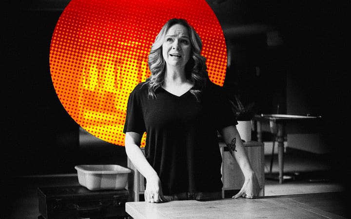 Black and white photo of a distressed woman, hands on a table, against a red halftone circle.